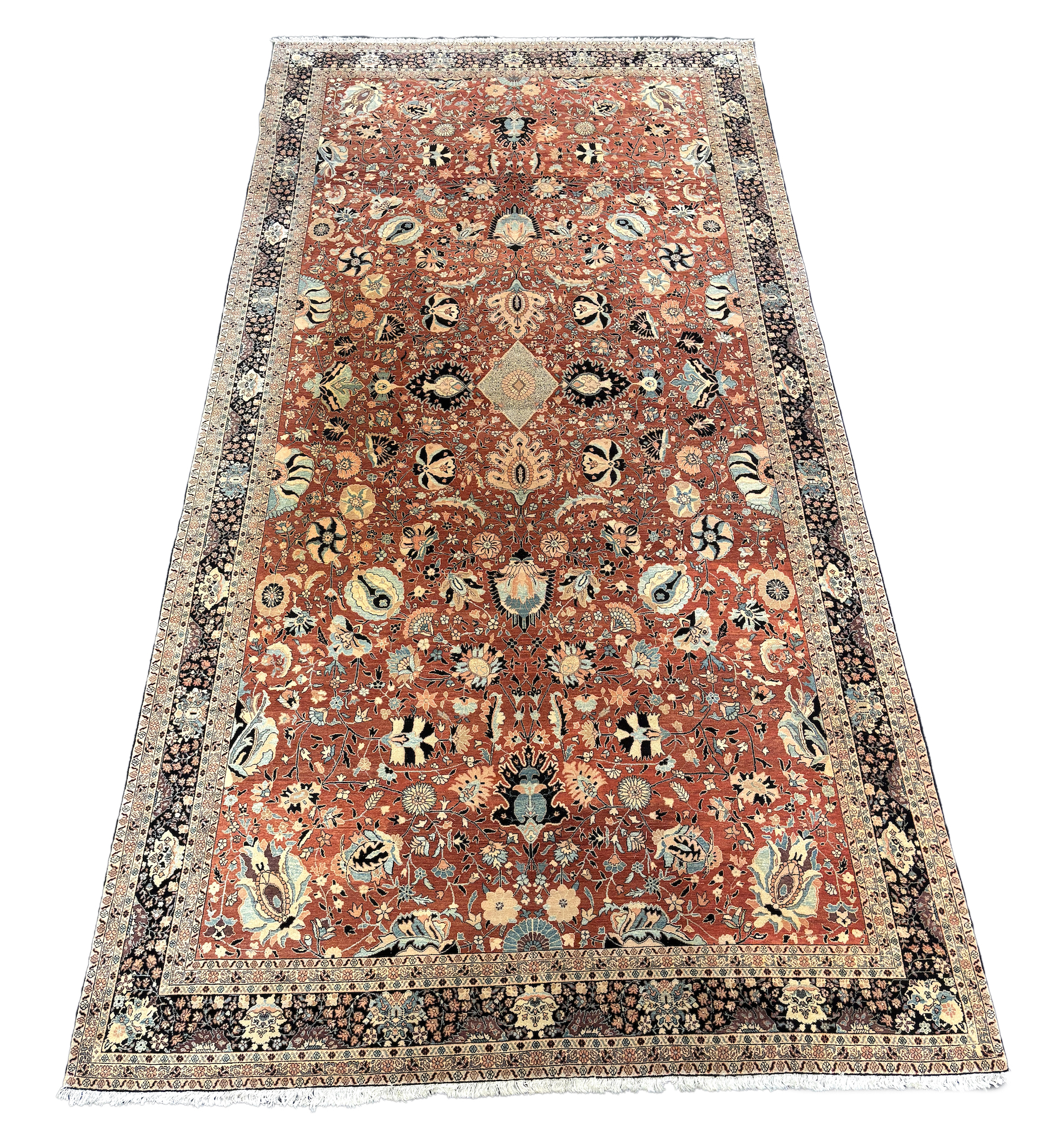 A Tabriz brick red ground gallery carpet 575 x 300cm